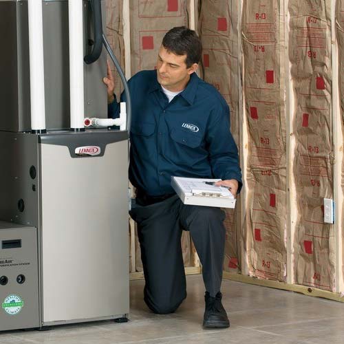Technician installing a furnace